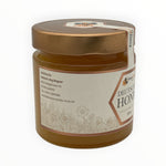 Bienenprodukte Shop Frühjahrsblütenhonig im 500g Glas mit feincremiger Textur und floralem Etikettendesign